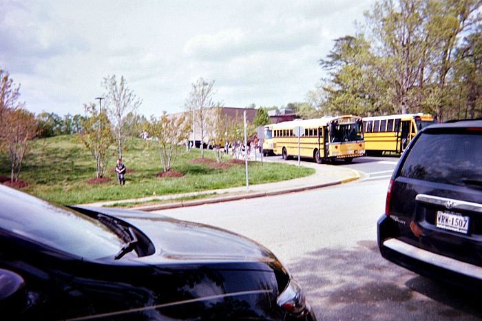 Education and technology photograph of kids leaving school