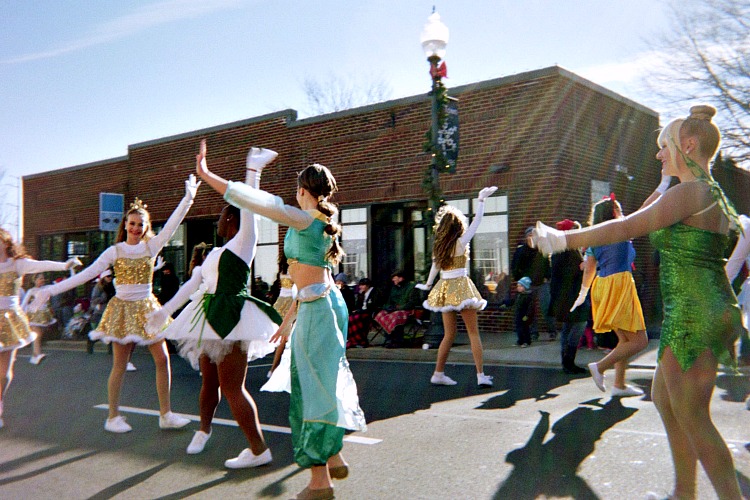 Girls dancing in a Christmas parade. Girls dancing in a Christmas parade.