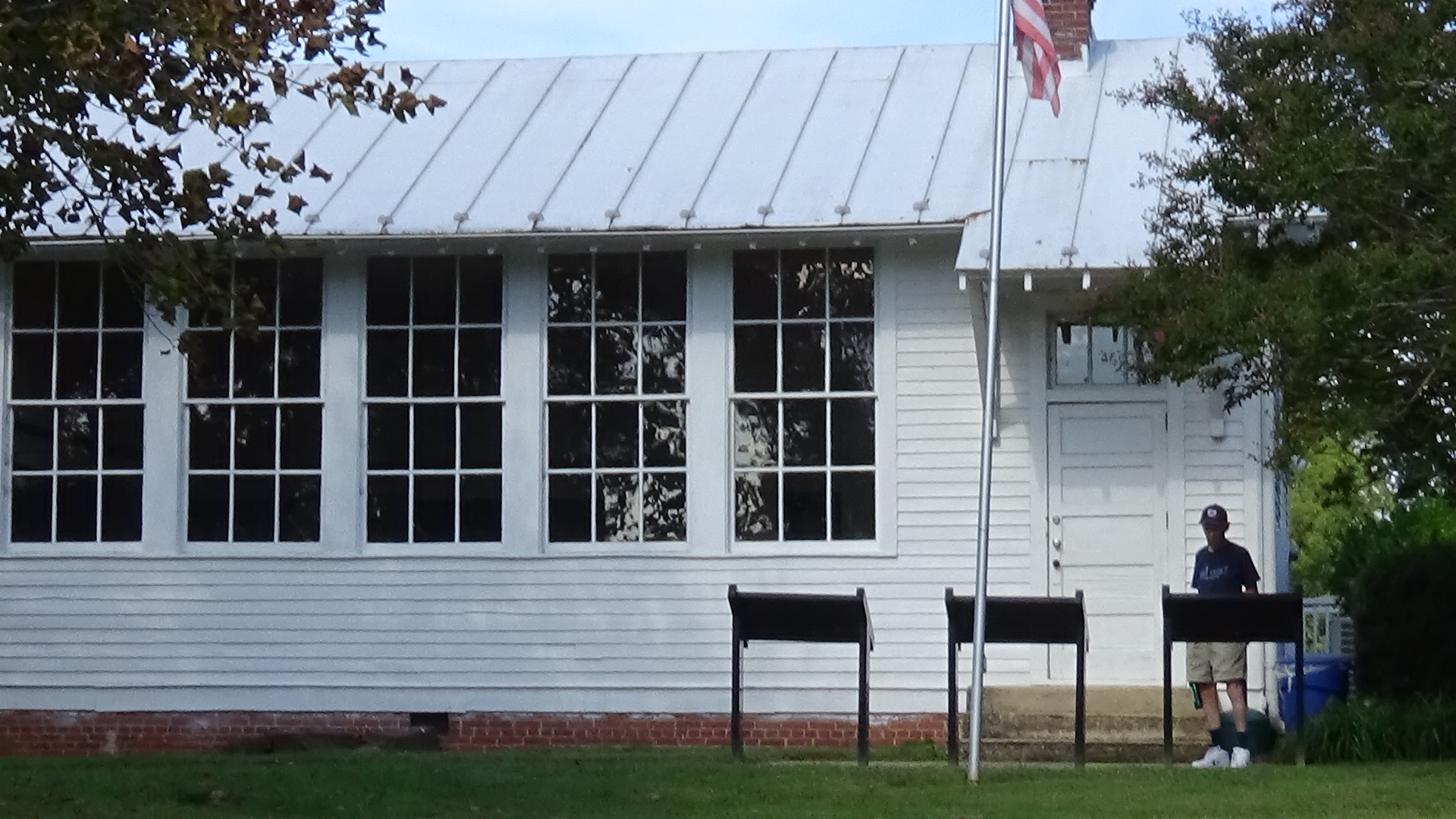 Darwin reading signs at a court house school