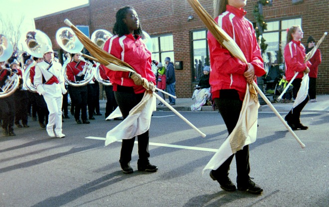 Flag bearers in a Christmas parade.