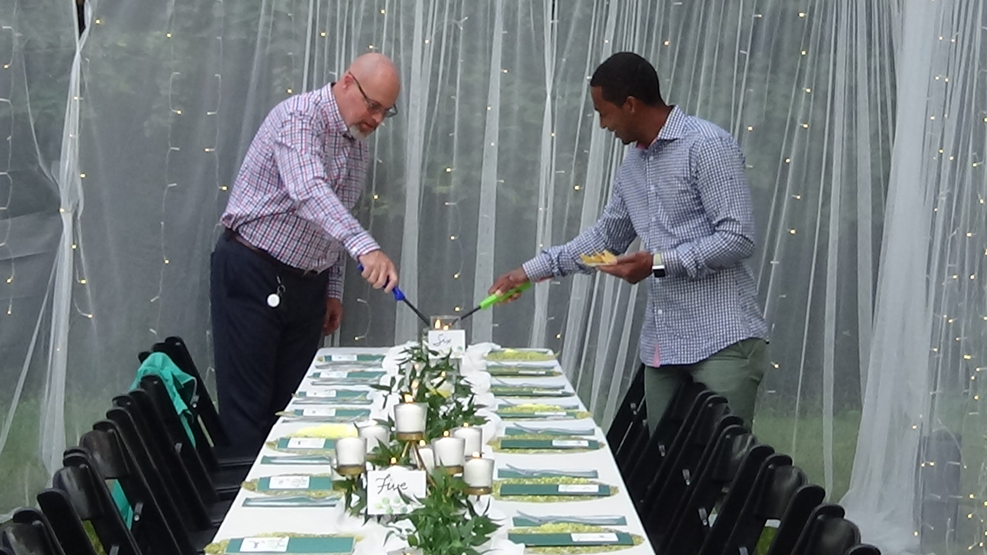 Lighting candles for a party.