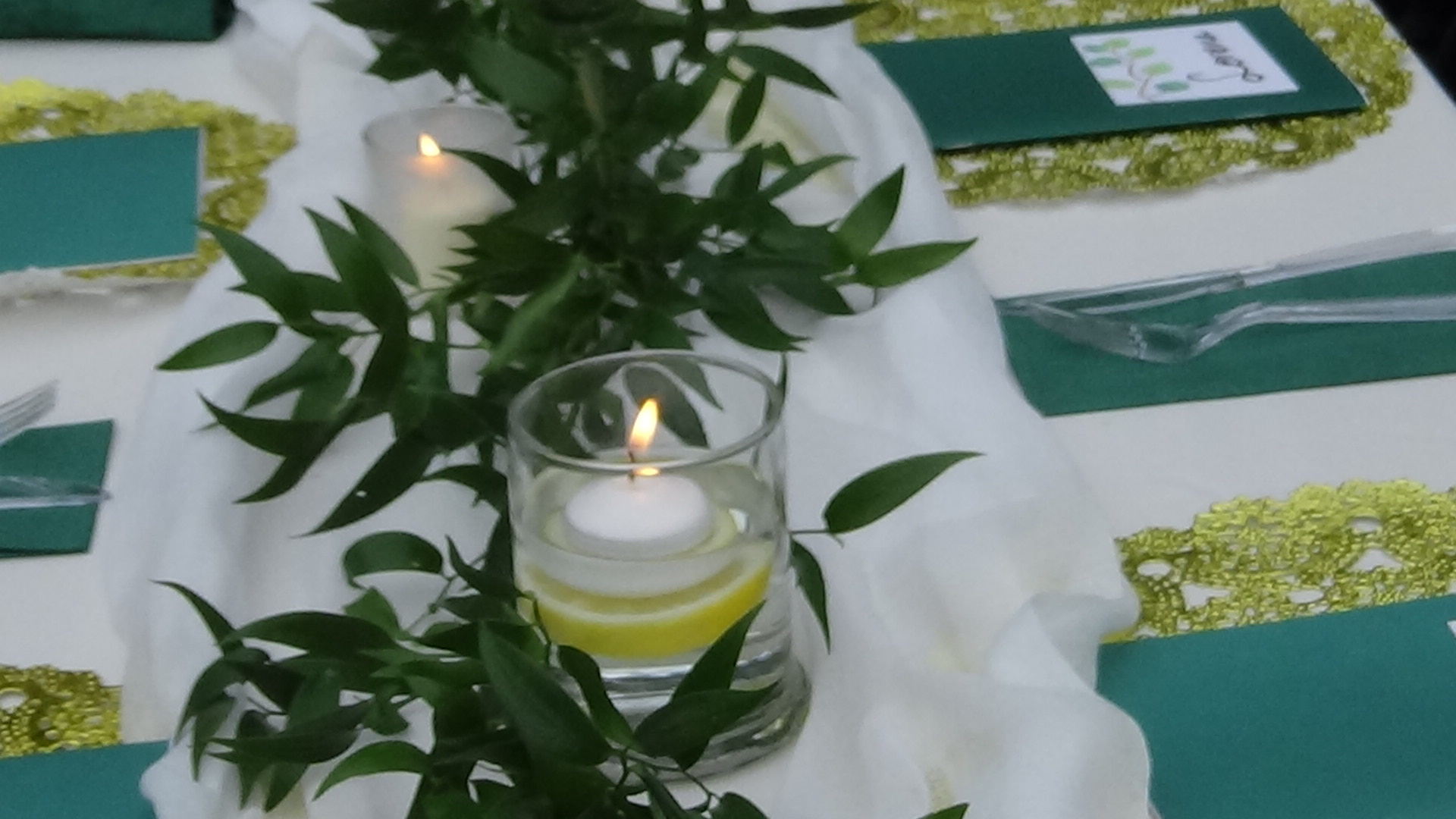 Lit candles on a table.