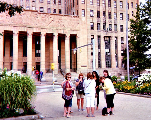 Teachers in front of City Hall in Buffalo, NY using apps for mobile phones.