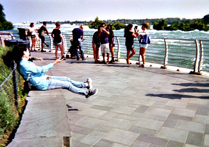 People using mobile phones to take photographs of Niagara Falls.