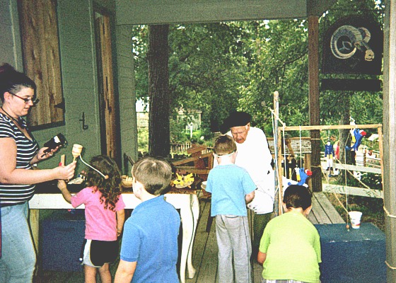 Toymaker at colonial fair in South Carolina.