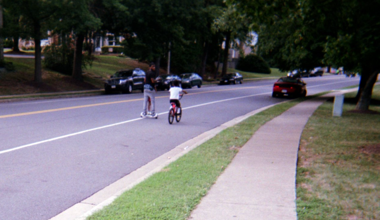 Bicycle rider in the neighborhood.